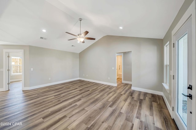 unfurnished living room featuring light hardwood / wood-style flooring, ceiling fan, lofted ceiling, and sink