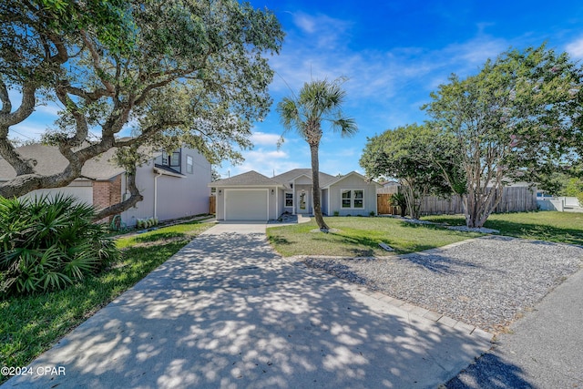 single story home featuring a garage and a front lawn