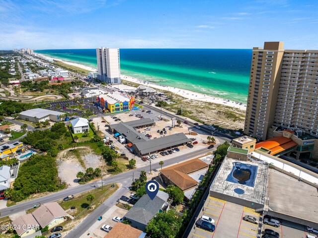 bird's eye view featuring a water view and a view of the beach