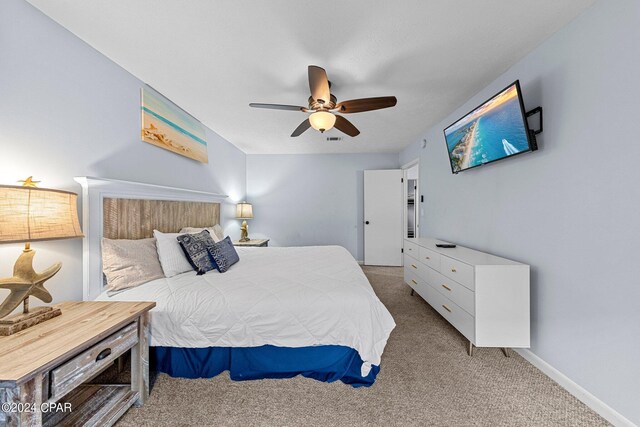 bedroom with light colored carpet and ceiling fan