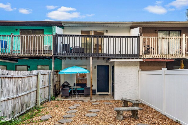 rear view of house with a patio area