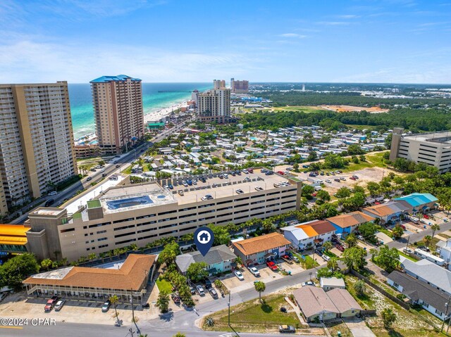 bird's eye view featuring a view of the beach and a water view