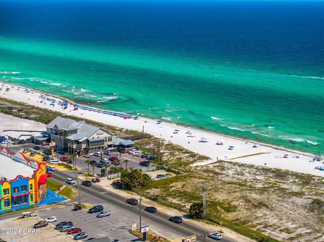 bird's eye view featuring a water view and a view of the beach