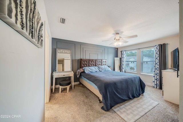 carpeted bedroom with ceiling fan