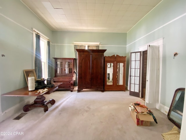 interior space featuring carpet flooring and french doors