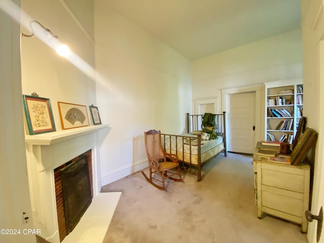 living area featuring carpet flooring and a fireplace