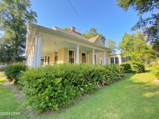 view of home's exterior with a yard