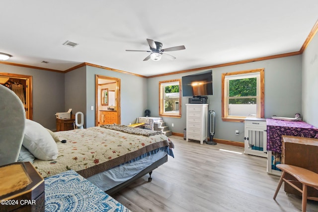 bedroom featuring ceiling fan, multiple windows, crown molding, and wood-type flooring