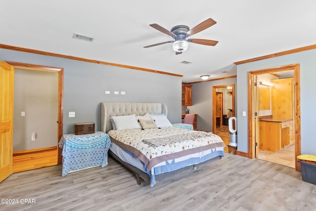 bedroom featuring ceiling fan, connected bathroom, ornamental molding, and light hardwood / wood-style flooring