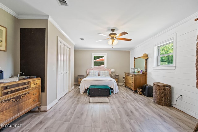 bedroom with wood-type flooring, multiple windows, and ceiling fan