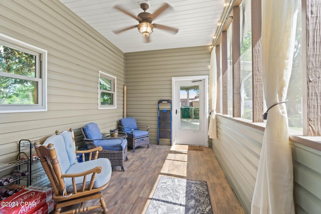 sunroom featuring ceiling fan