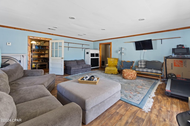 living room featuring ornamental molding and hardwood / wood-style flooring