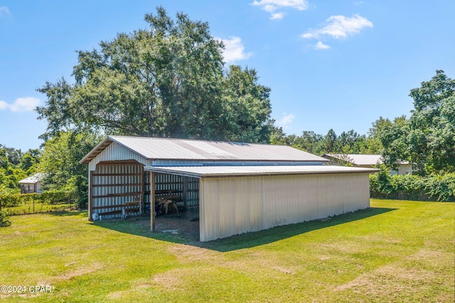 view of outdoor structure with a lawn