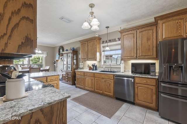 kitchen with a chandelier, sink, stainless steel appliances, and ornamental molding