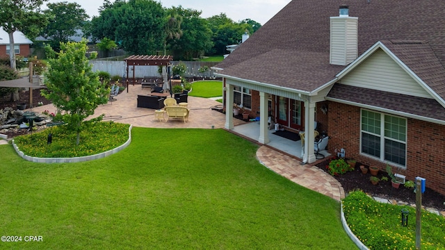 view of yard with a pergola and a patio area