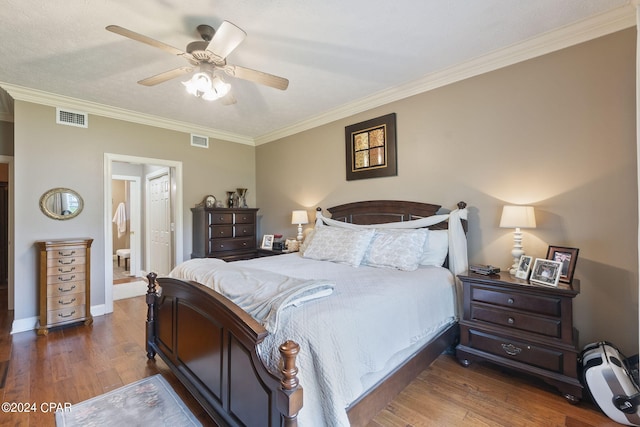 bedroom with ceiling fan, crown molding, and dark hardwood / wood-style floors