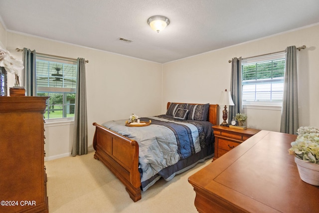 carpeted bedroom featuring ornamental molding