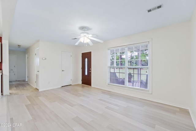 foyer entrance with ceiling fan and light hardwood / wood-style flooring