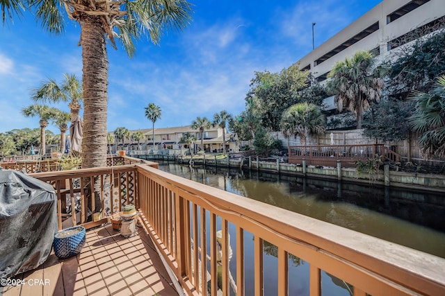 exterior space with a grill and a water view