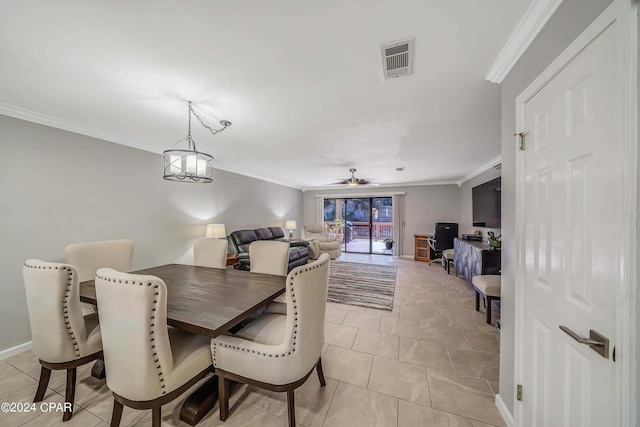 tiled dining room featuring ceiling fan and ornamental molding