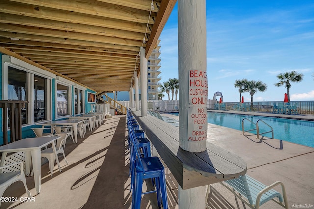 view of swimming pool with a patio area