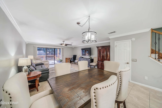 tiled dining room featuring ceiling fan with notable chandelier and crown molding