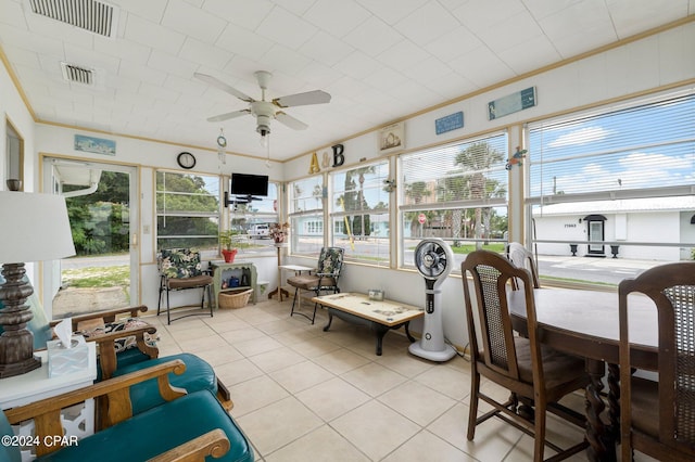 sunroom with ceiling fan and a wealth of natural light