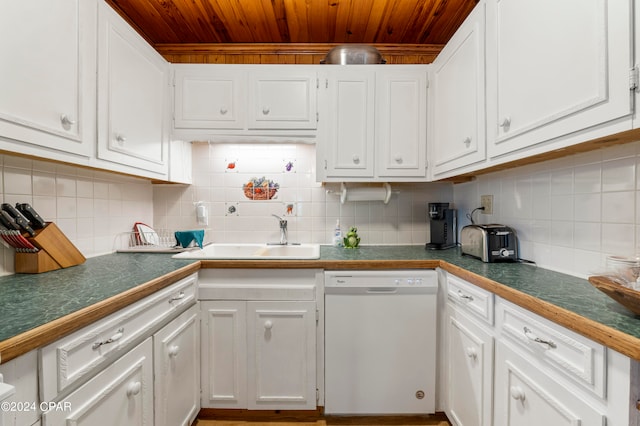 kitchen featuring white cabinetry, sink, white dishwasher, and tasteful backsplash