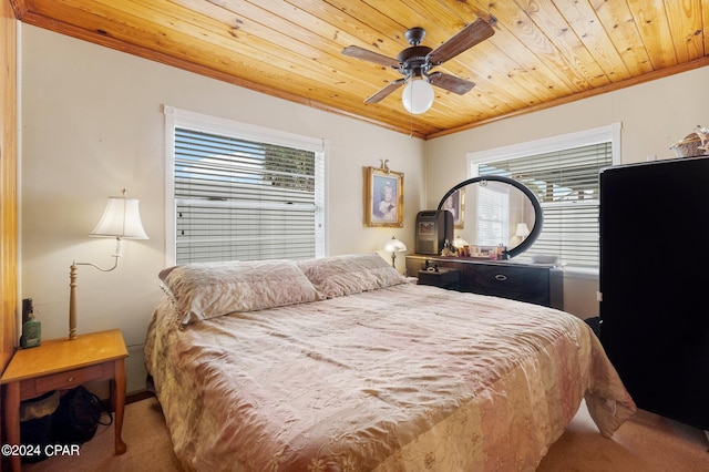 bedroom featuring light carpet, multiple windows, wooden ceiling, and ceiling fan