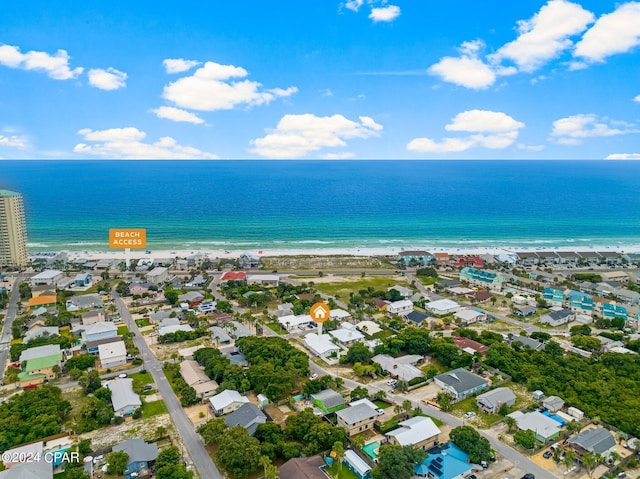 birds eye view of property featuring a view of the beach and a water view