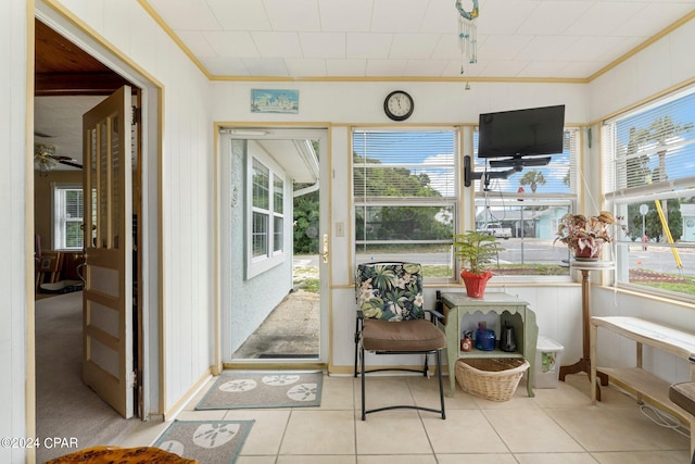 sunroom / solarium with ceiling fan and plenty of natural light