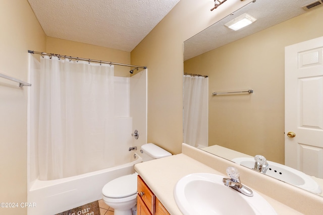 full bathroom featuring a textured ceiling, tile patterned floors, vanity, shower / bath combination with curtain, and toilet