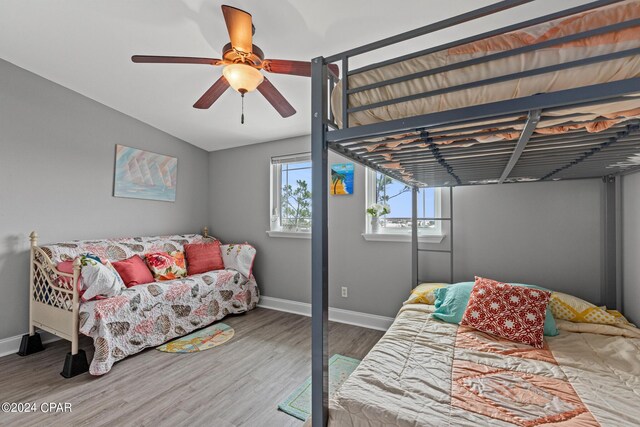 bedroom with hardwood / wood-style floors and ceiling fan