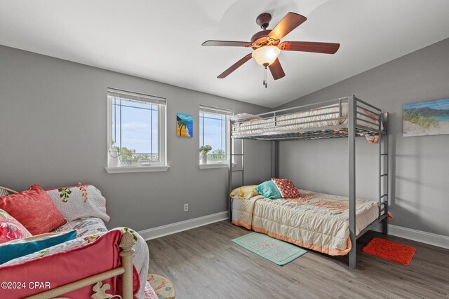 bedroom featuring vaulted ceiling, ceiling fan, and hardwood / wood-style flooring