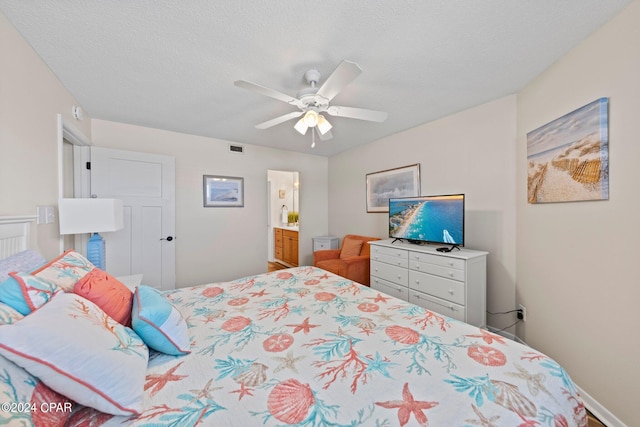 bedroom featuring ceiling fan, connected bathroom, and a textured ceiling