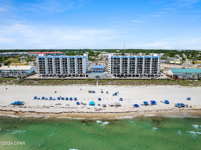 drone / aerial view with a view of the beach and a water view