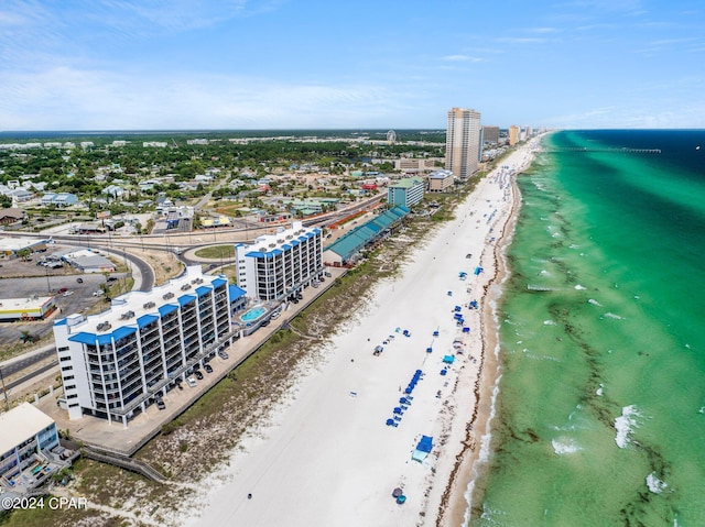 bird's eye view featuring a water view and a beach view