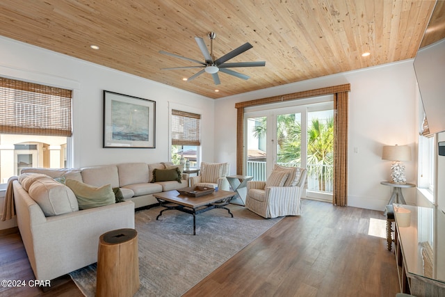 living room with ceiling fan, a healthy amount of sunlight, hardwood / wood-style flooring, and wooden ceiling