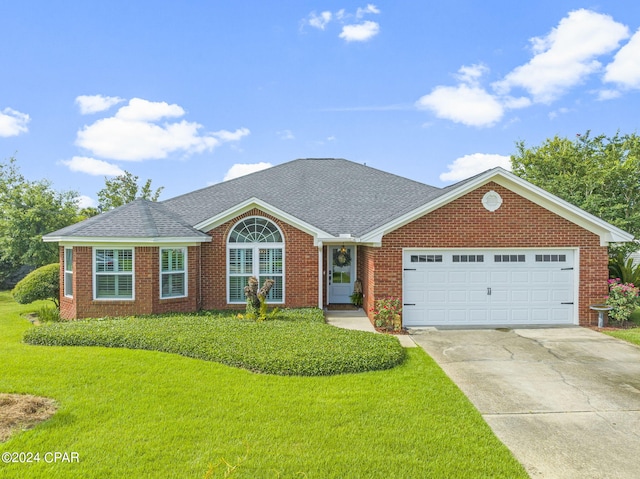 single story home with a front lawn and a garage