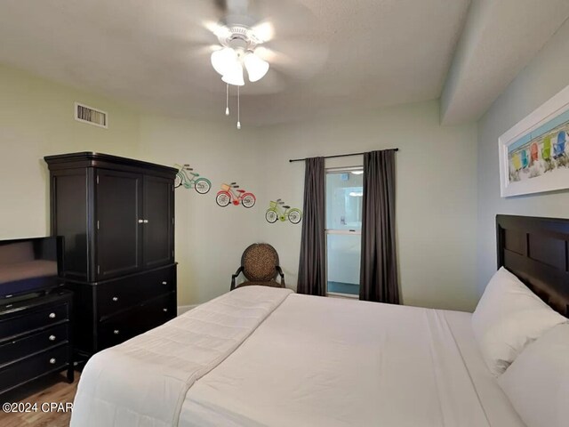 bedroom with ceiling fan and hardwood / wood-style floors