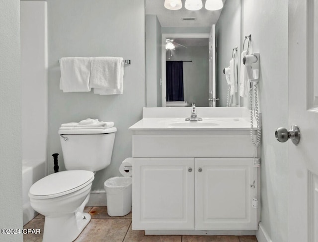 full bathroom with tile patterned floors, vanity, shower / tub combo, and toilet