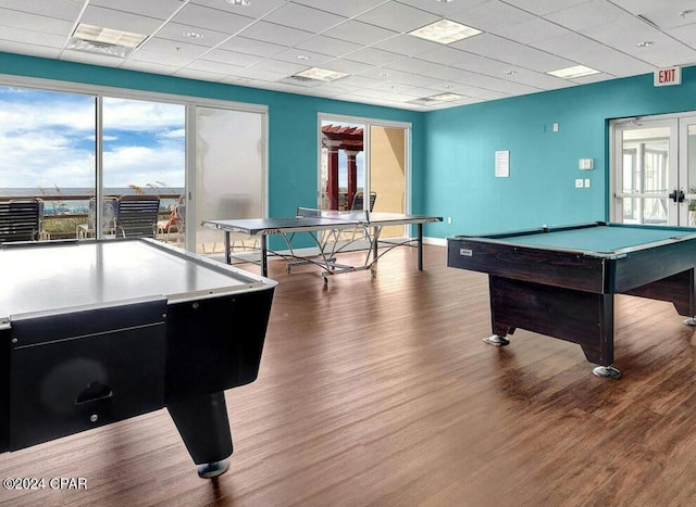 game room featuring french doors, a paneled ceiling, pool table, and hardwood / wood-style flooring