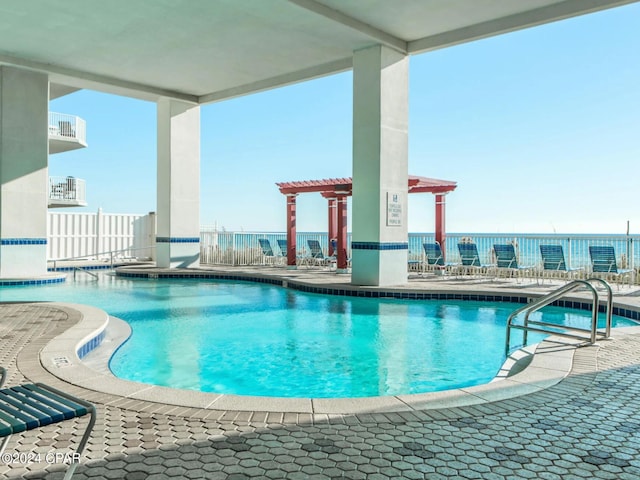 view of pool featuring a pergola and a patio