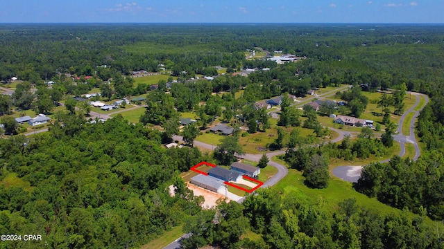 aerial view featuring a wooded view