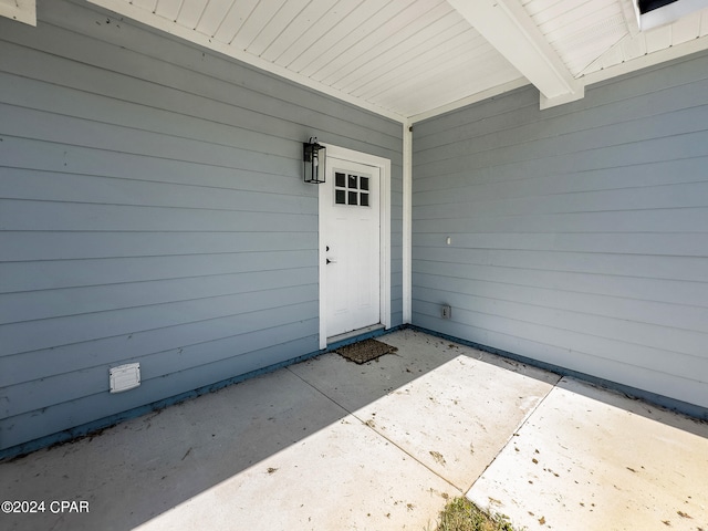 entrance to property with a patio