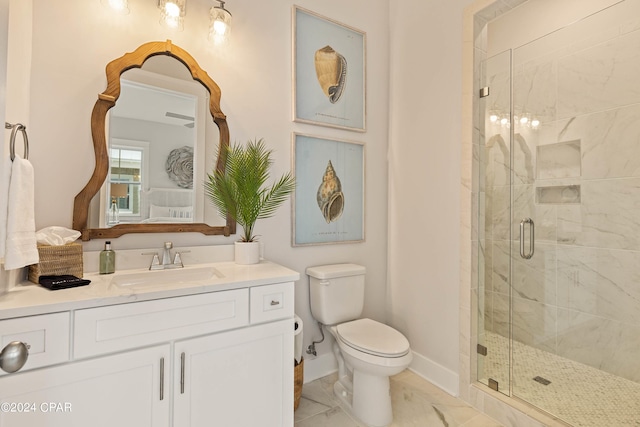 bathroom featuring vanity, toilet, and an enclosed shower