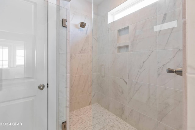 bathroom featuring an enclosed shower