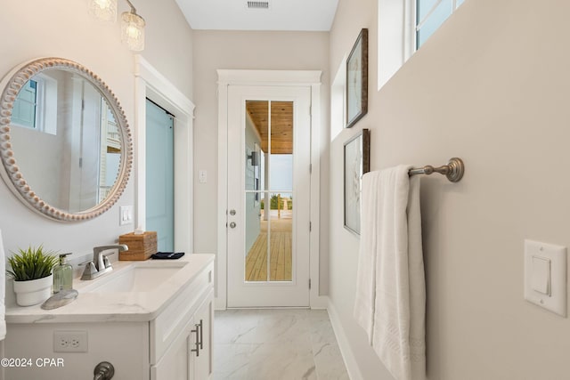 doorway featuring a wealth of natural light and sink