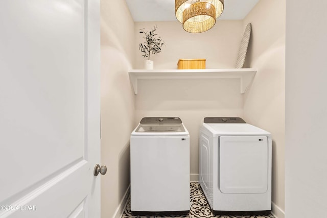 clothes washing area with washer and dryer