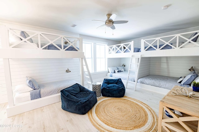 bedroom with hardwood / wood-style floors and ceiling fan